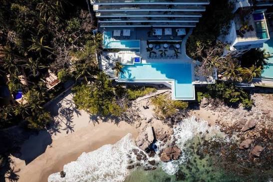 Aerial view of Sayan Beach's infinity pool and private beach in Puerto Vallarta's Romantic Zone